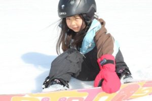 Kyra snowboards at age 5