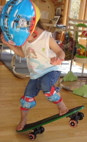 Kyra skateboarding at age 3